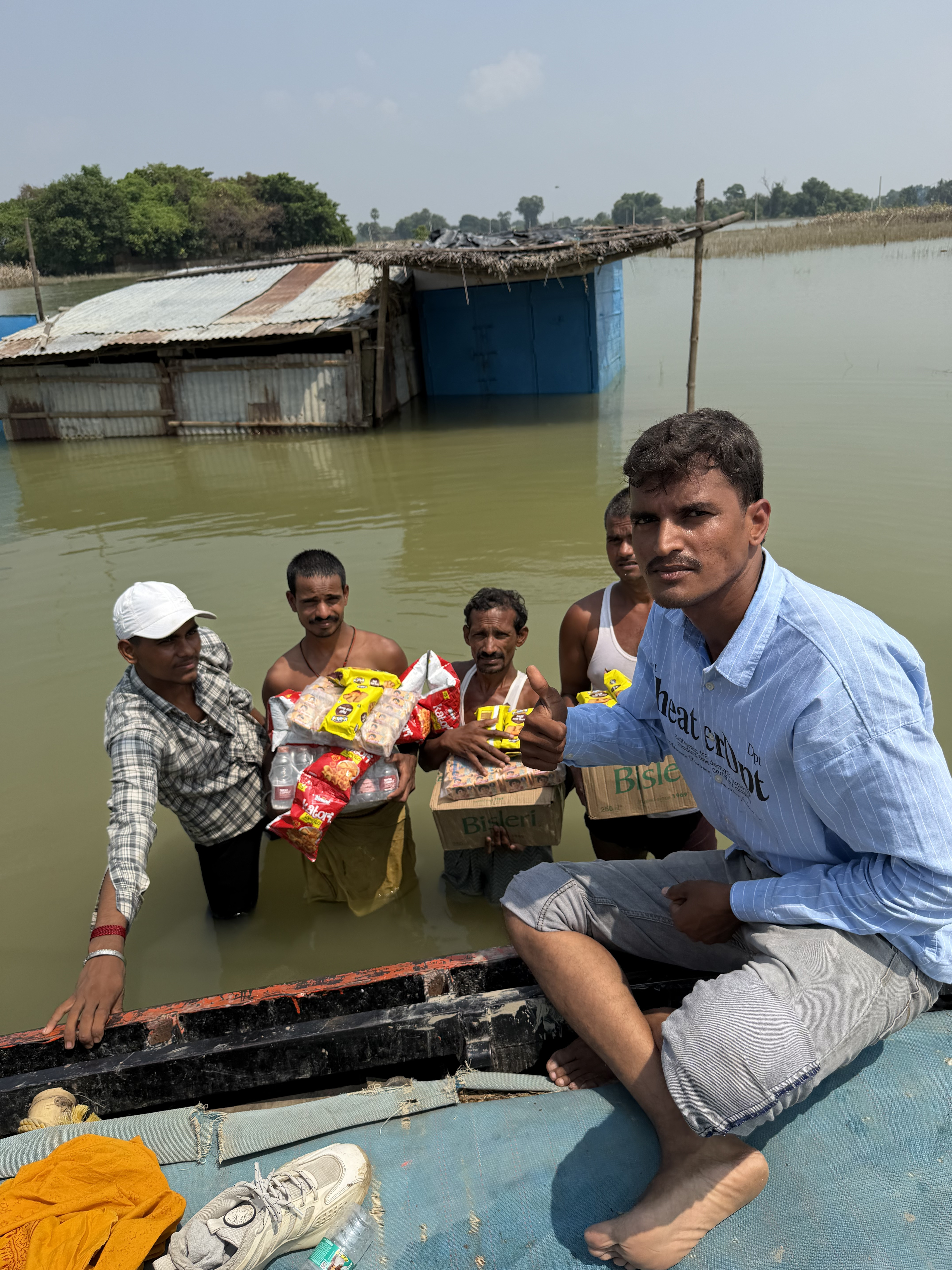 Flood relief distributing food and water by boat